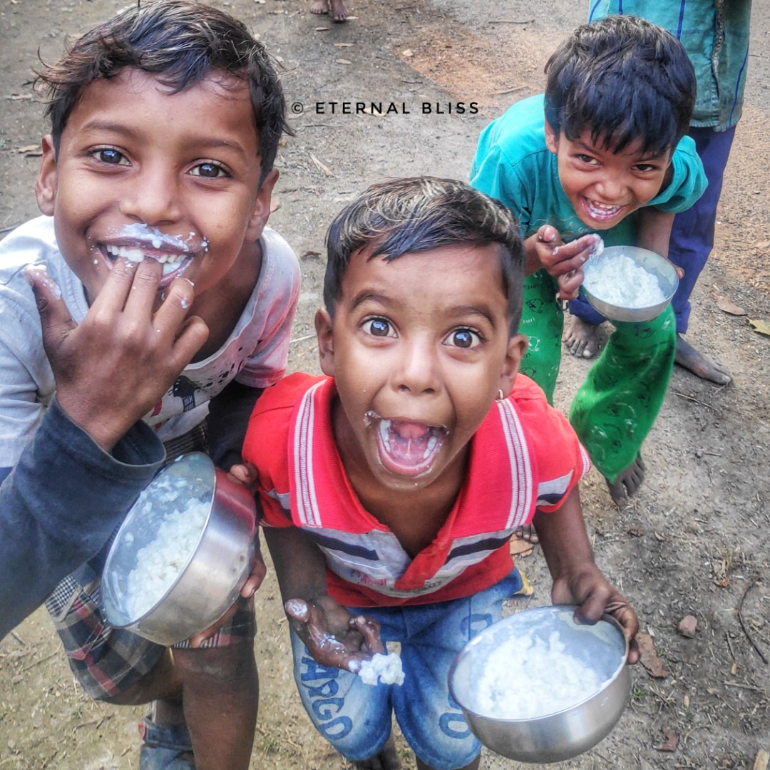 Children sharing a meal served by Eternal Bliss